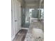 Bathroom with white cabinets, granite countertops, double sinks, and glass shower at 410 5Th Ave. S, North Myrtle Beach, SC 29582