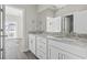 Bright bathroom featuring a double vanity with granite countertops and modern fixtures at 410 5Th Ave. S, North Myrtle Beach, SC 29582
