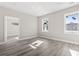 New bedroom with lots of light, neutral walls, and wood-look floors at 410 5Th Ave. S, North Myrtle Beach, SC 29582