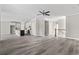 Spacious living room with hardwood floors and an open floor plan into the kitchen area at 410 5Th Ave. S, North Myrtle Beach, SC 29582