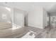 New living room with stairs, neutral walls, and wood-look floors at 410 5Th Ave. S, North Myrtle Beach, SC 29582