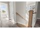 Bright foyer featuring a wooden staircase and access to the bathroom at 410 5Th Ave. S, North Myrtle Beach, SC 29582