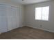 Simple bedroom with neutral walls and carpet at 510 Fairwood Lakes Dr. # 16M, Myrtle Beach, SC 29588