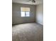 Spacious carpeted bedroom with window and ceiling fan at 510 Fairwood Lakes Dr. # 16M, Myrtle Beach, SC 29588