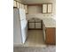 Simple kitchen with white appliances and wood cabinets at 510 Fairwood Lakes Dr. # 16M, Myrtle Beach, SC 29588