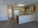 Galley style kitchen with white appliances and wood cabinets at 510 Fairwood Lakes Dr. # 16M, Myrtle Beach, SC 29588