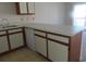 L-shaped kitchen with white cabinets at 510 Fairwood Lakes Dr. # 16M, Myrtle Beach, SC 29588