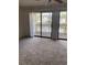 Living room with sliding glass doors to a balcony at 510 Fairwood Lakes Dr. # 16M, Myrtle Beach, SC 29588