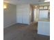 Living room with carpet, double door closet and kitchen at 510 Fairwood Lakes Dr. # 16M, Myrtle Beach, SC 29588