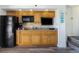 Small kitchenette with black appliances at 4800 S Ocean Blvd. # 824, North Myrtle Beach, SC 29582