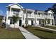 Charming townhome featuring a welcoming front porch and well-manicured lawn at 821 Maxine Ct. # 2B, Myrtle Beach, SC 29577