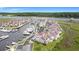Aerial view showcasing waterfront condos with a marina, surrounded by lush greenery and waterways at 4396 Baldwin Ave. # 47, Little River, SC 29566