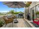 Relaxing covered balcony with outdoor seating and a blue bicycle, perfect for enjoying the weather at 4396 Baldwin Ave. # 47, Little River, SC 29566