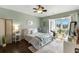 Bright bedroom with balcony access features a soft color palette, comfortable queen bed, and decorative accents at 4396 Baldwin Ave. # 47, Little River, SC 29566