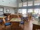 Inviting common area featuring plenty of seating with tables, chairs, and lots of natural light at 4396 Baldwin Ave. # 47, Little River, SC 29566