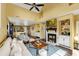 Open-concept living room with fireplace and views into the kitchen offers plenty of space for entertaining and relaxing at 4396 Baldwin Ave. # 47, Little River, SC 29566