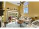 Sun-filled living room boasts high ceilings, large windows, and a cozy seating area with a view of the outdoor patio at 4396 Baldwin Ave. # 47, Little River, SC 29566