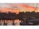 Picturesque marina scene with boats docked under a colorful sunset sky, showcasing waterfront living at 4396 Baldwin Ave. # 47, Little River, SC 29566