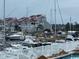 Picturesque harbor view with boats docked near charming waterfront homes, offering a tranquil coastal lifestyle at 4396 Baldwin Ave. # 47, Little River, SC 29566