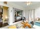 Bright sunroom with tiled floor and golf clubs leading into the bedroom through sliding glass doors at 4396 Baldwin Ave. # 47, Little River, SC 29566