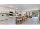 Modern kitchen with white cabinets, granite island, and stainless steel appliances at 101 Millport Ct., Little River, SC 29566