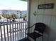 Relaxing balcony with chair, offering street and partial ocean views at 6305 N Ocean Blvd. # B-3, North Myrtle Beach, SC 29582