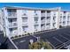 Three-story building with parking and gated access at 6305 N Ocean Blvd. # B-3, North Myrtle Beach, SC 29582