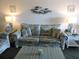 Living room with couches, coffee table, and coastal decor at 6305 N Ocean Blvd. # B-3, North Myrtle Beach, SC 29582