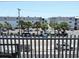 View of the parking lot and nearby buildings from a balcony at 6305 N Ocean Blvd. # B-3, North Myrtle Beach, SC 29582
