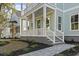 Charming front porch with classic columns and steps leading up to the entrance of the home at 1604 James Island Ave., North Myrtle Beach, SC 29582