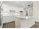 An open kitchen with white cabinets, granite countertops, and stainless steel appliances at 1604 James Island Ave., North Myrtle Beach, SC 29582