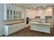 A bright kitchen showcasing custom white cabinetry, granite countertops, and modern appliances at 1604 James Island Ave., North Myrtle Beach, SC 29582