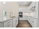 Modern white kitchen with stainless steel appliances at 1604 James Island Ave., North Myrtle Beach, SC 29582