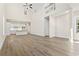 Bright and open living room with high ceilings, hardwood floors, and a view of the kitchen at 1604 James Island Ave., North Myrtle Beach, SC 29582