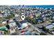 Aerial view of the home, highlighting proximity to nearby houses, streets, and the ocean at 2401 Duffy St., North Myrtle Beach, SC 29582