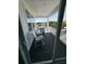 Relax on the covered balcony with views of the water featuring modern seating and composite decking at 2401 Duffy St., North Myrtle Beach, SC 29582