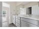 Spacious bathroom with double sinks, gray cabinets, and a large mirror, combining style and functionality at 2401 Duffy St., North Myrtle Beach, SC 29582
