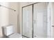 Bathroom featuring enclosed glass shower and toilet at 2401 Duffy St., North Myrtle Beach, SC 29582