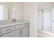 Modern bathroom features a sleek vanity with gray cabinets, a light countertop, and a glass-enclosed shower at 2401 Duffy St., North Myrtle Beach, SC 29582