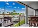 View from a balcony overlooking parking area and surrounding landscape, offering a relaxing outdoor space at 5905 S Kings Hwy. # A 115, Myrtle Beach, SC 29575