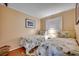 Cozy bedroom with two twin beds, beach themed bedding, and a relaxing atmosphere at 5905 S Kings Hwy. # A 115, Myrtle Beach, SC 29575