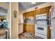Charming kitchen featuring wood cabinets, tiled backsplash, and stainless steel appliances at 5905 S Kings Hwy. # A 115, Myrtle Beach, SC 29575