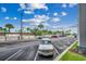 Open parking lot view with tropical palm trees and blue sky overhead at 5905 S Kings Hwy. # A 115, Myrtle Beach, SC 29575