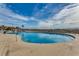 Exterior view of a large outdoor pool with surrounding lounge area, perfect for relaxation and recreation at 5905 S Kings Hwy. # A 115, Myrtle Beach, SC 29575