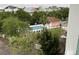 Aerial view shows community pool, mature trees and the surrounding neighborhood at 1207 Salt Windy Way, North Myrtle Beach, SC 29582
