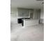 Kitchen features spacious island with granite counters, dark cabinets, and an open layout at 1207 Salt Windy Way, North Myrtle Beach, SC 29582