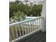 Community pool view from the balcony with comfortable lounge chairs and manicured landscape at 1207 Salt Windy Way, North Myrtle Beach, SC 29582