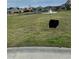 Photo of the grassy vacant lot with a For Sale sign at 2115 Mirabel Ct., North Myrtle Beach, SC 29582