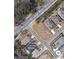 Aerial view of a residential lot surrounded by established homes and lush green trees at 5508 Via Verde Dr., North Myrtle Beach, SC 29582