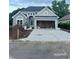 Charming single-story home featuring a stone accent wall and an attached two-car garage at 5508 Via Verde Dr., North Myrtle Beach, SC 29582